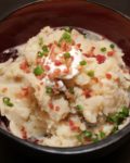 The best Slow Cooker Garlic Mashed Potatoes! Potatoes melt into broth and butter, then topped with bacon and chives | BearandBugEats.com