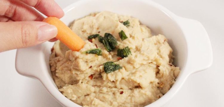 Healthy White Bean Dip for #FootballFoods! This simple warm dip is full of flavor without extra fat or sugar. Serve with baked chips for even more game time goodness! | BearandBugEats.com