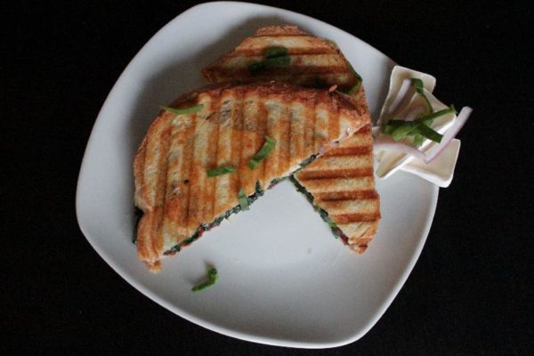 Completed bacon brie panini on plate