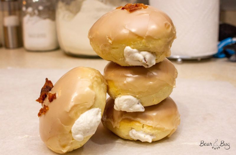 Stack of finished maple bacon cream baked donuts